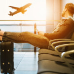 a man sitting on a chair with his feet on his back