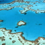 an aerial view of a blue ocean