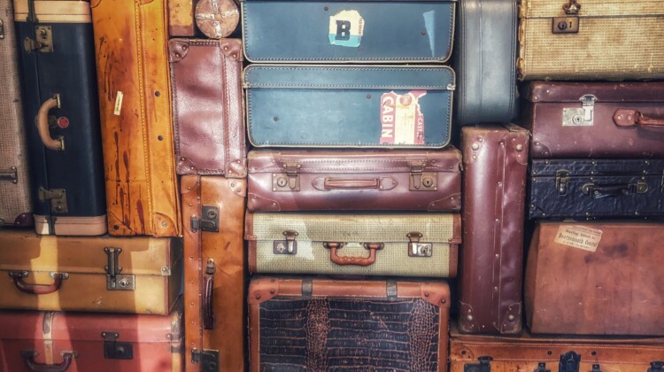 a group of suitcases stacked in a pile