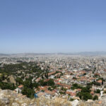 a city with many buildings and trees