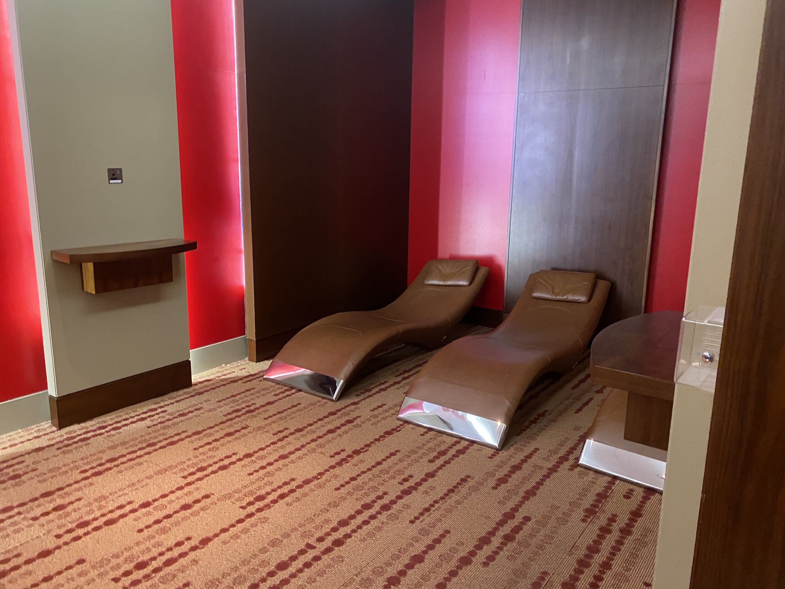 chairs in a room with red walls