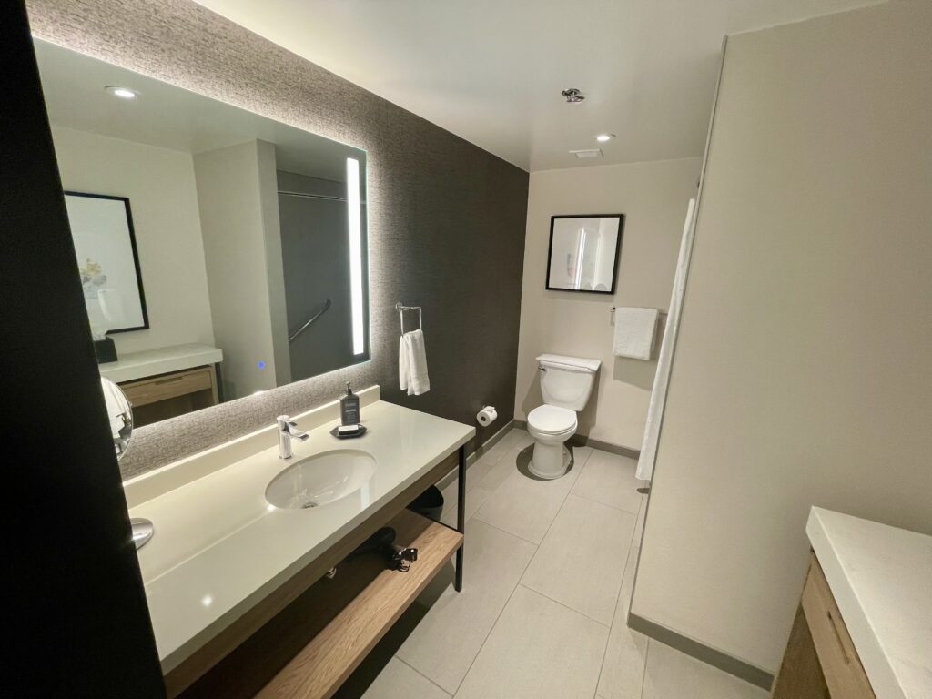 a bathroom with a mirror and sink