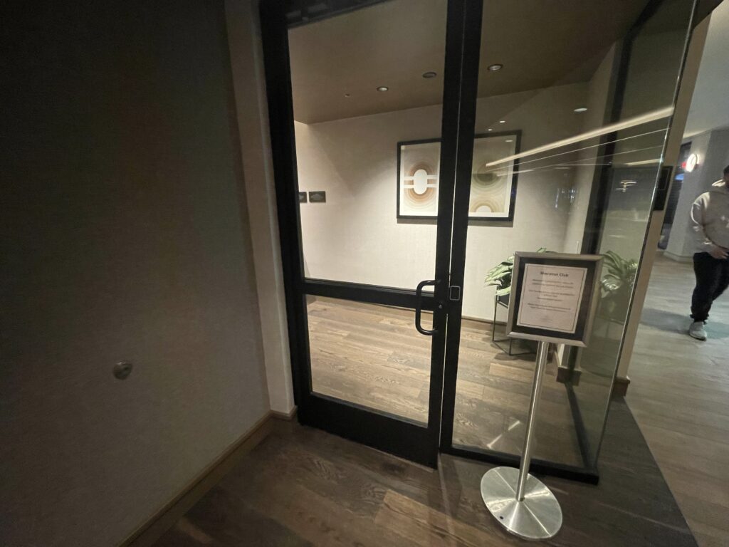 a glass door with a sign on the side
