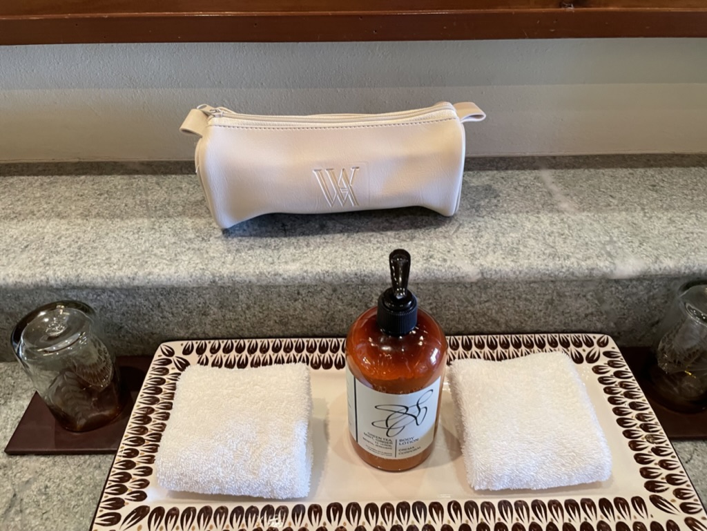 a towel and a bottle on a plate