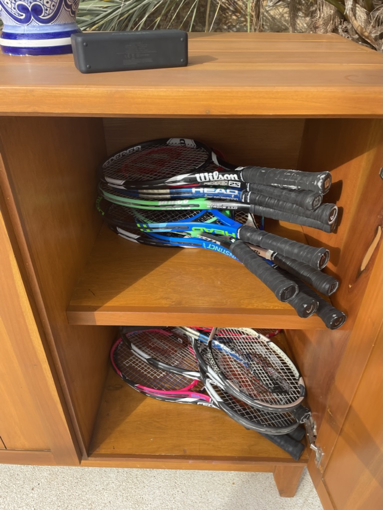 rackets on a shelf
