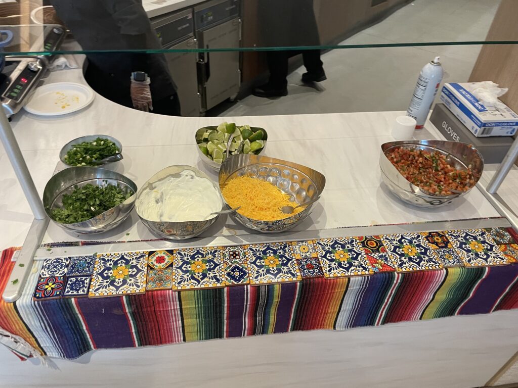a counter with bowls of food on it