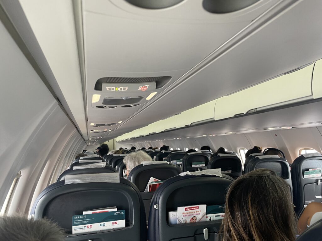 an airplane with seats and people in the back