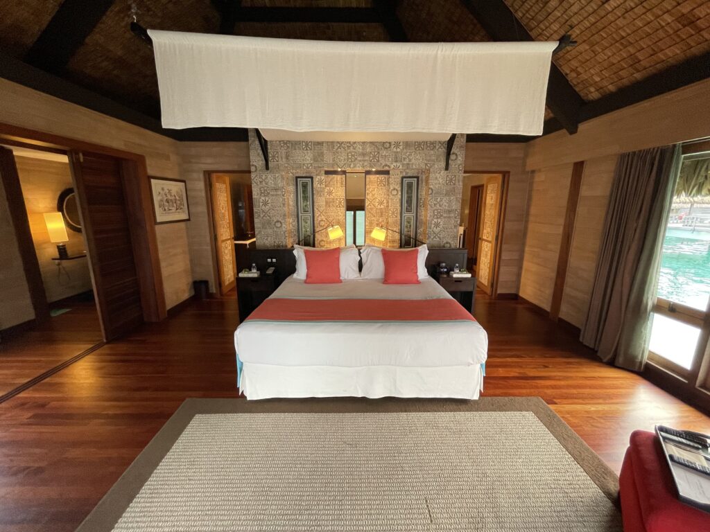 a room with a bed and a rug