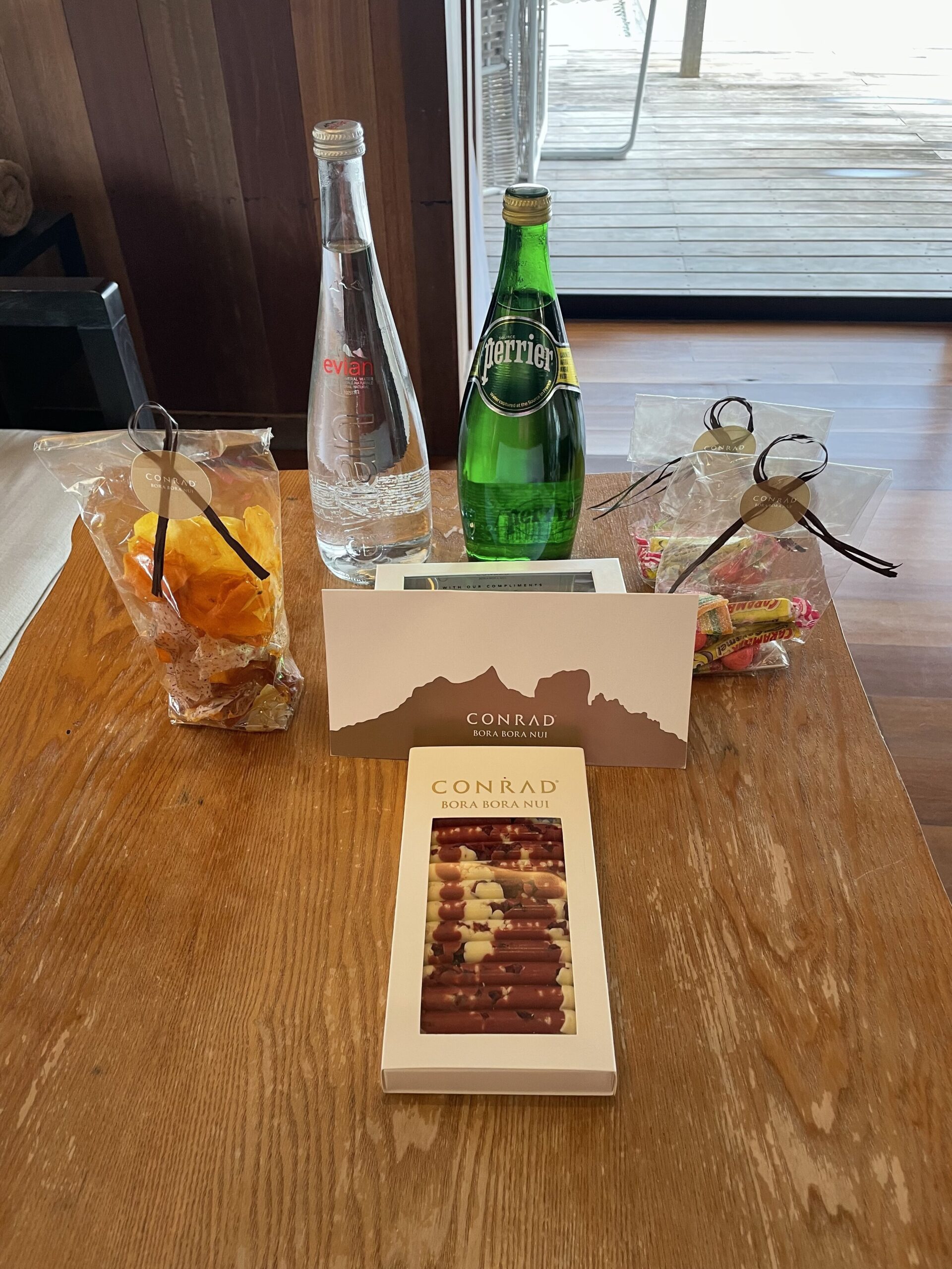 a table with a book and bottles of liquid