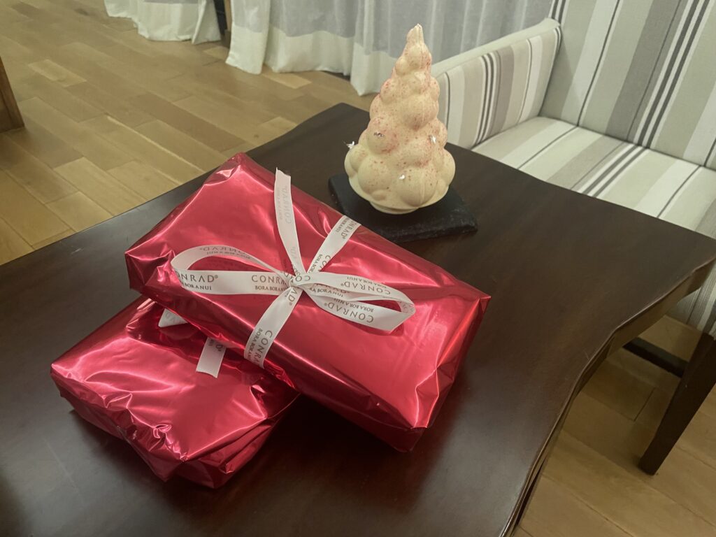 a couple of wrapped presents on a table