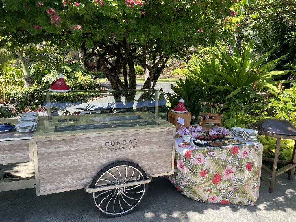a food cart with a table covered in flowers