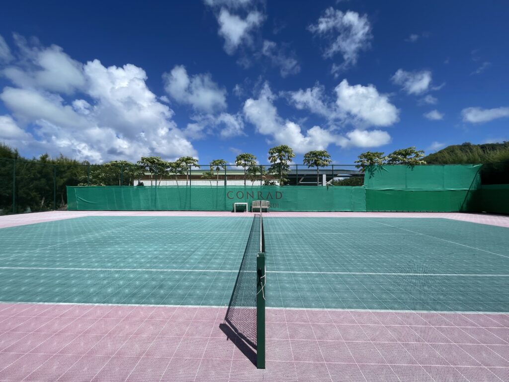 a tennis court with net and net on the ground