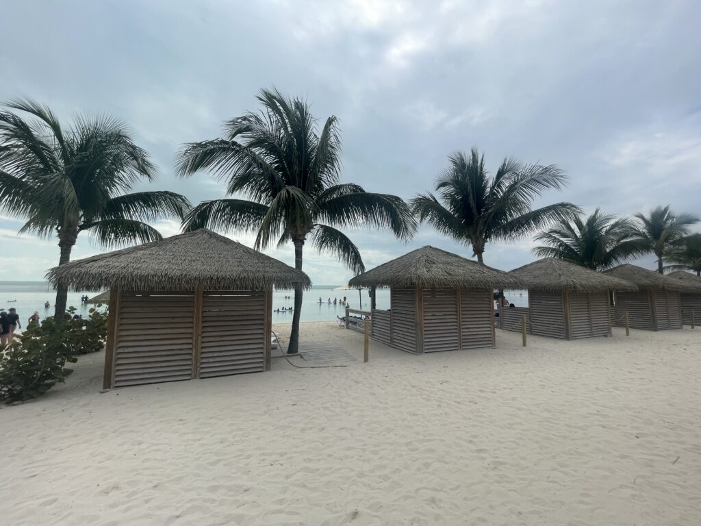 a group of huts on a beach