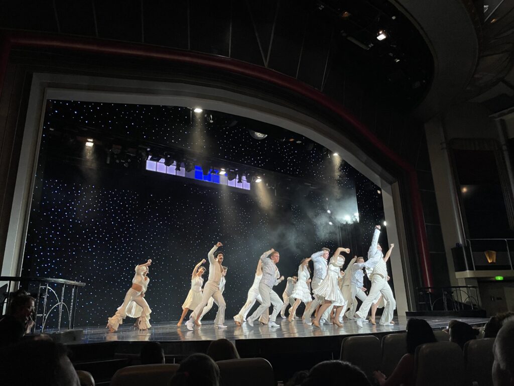 a group of people dancing on a stage