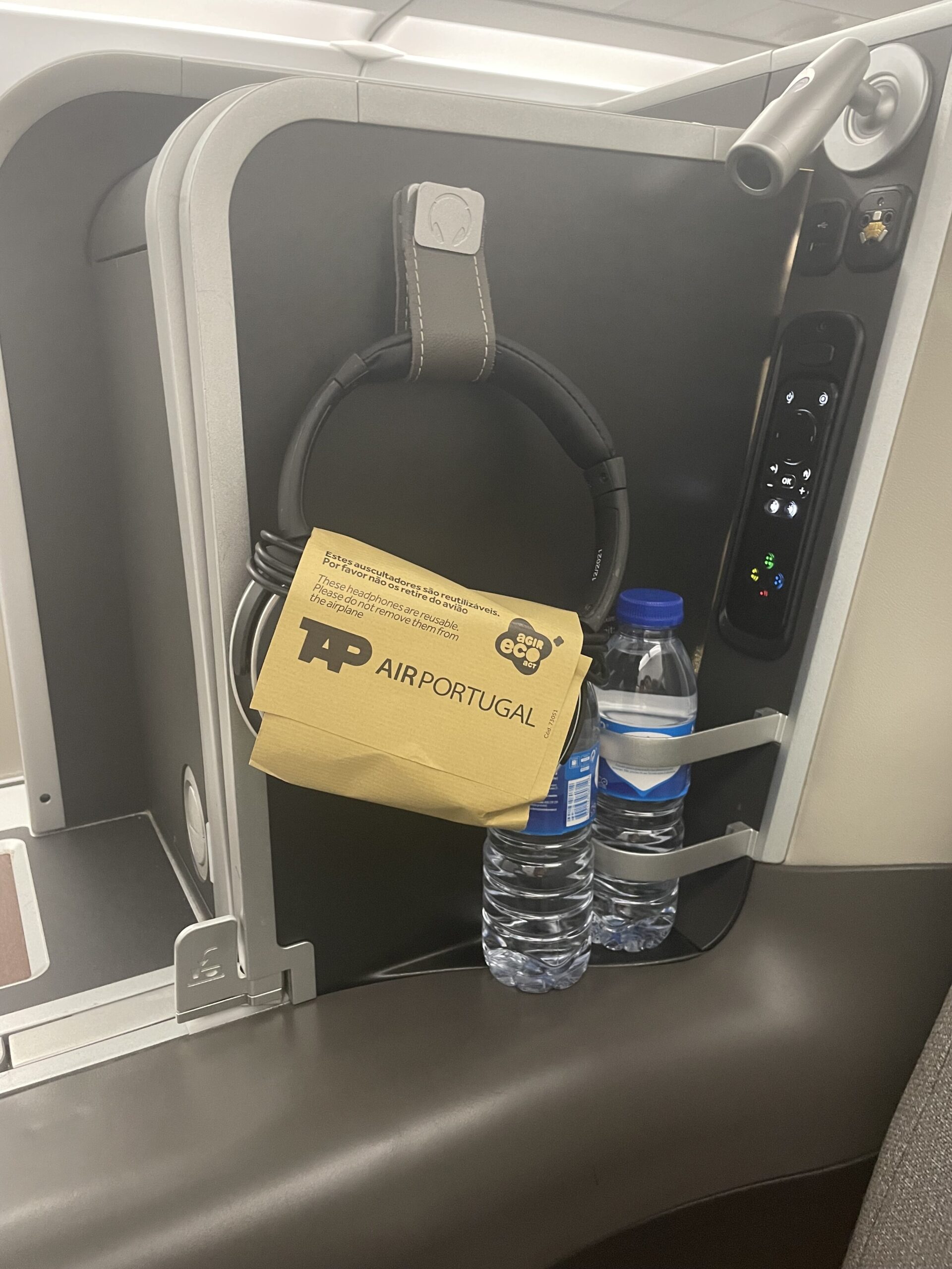 a pair of water bottles on a seat
