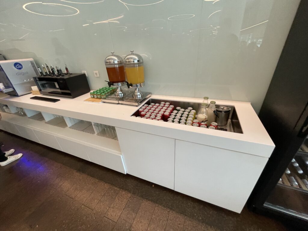 a white counter with drinks and beverages on it