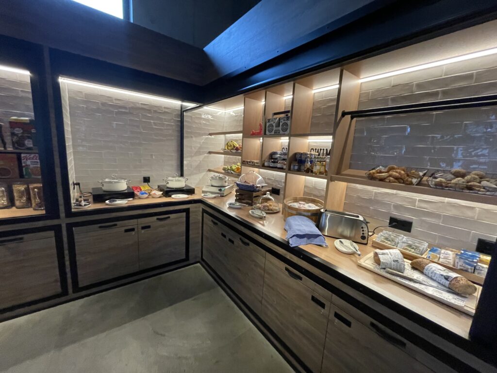 a kitchen with shelves and food on it