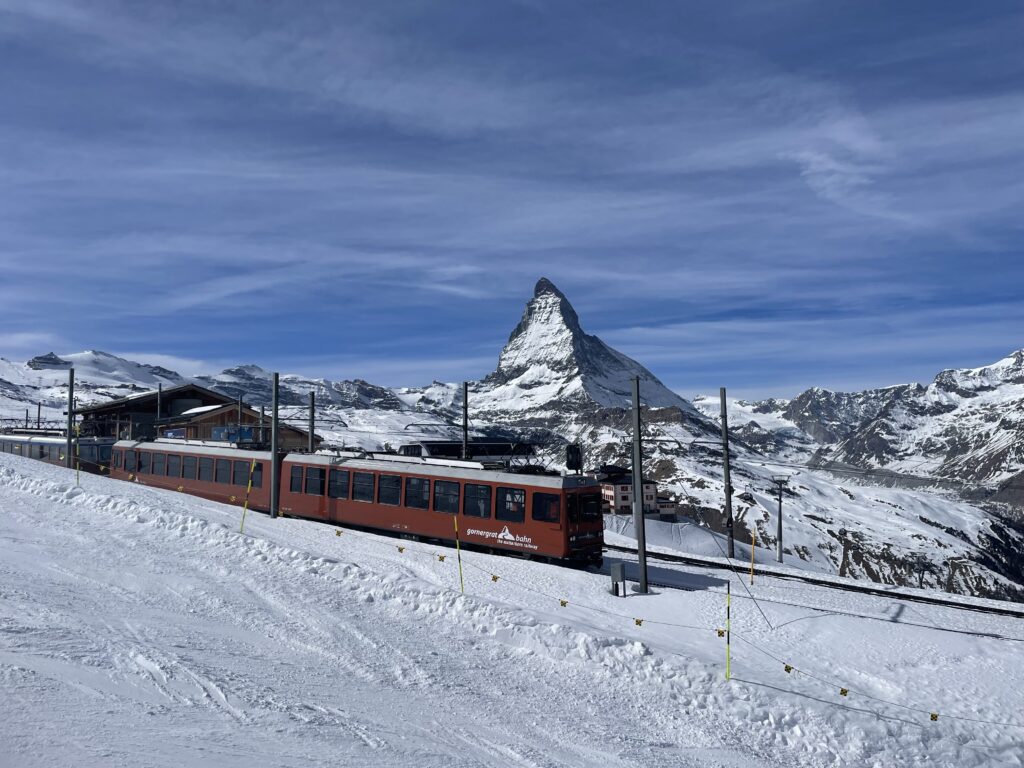 a train on a snowy mountain track