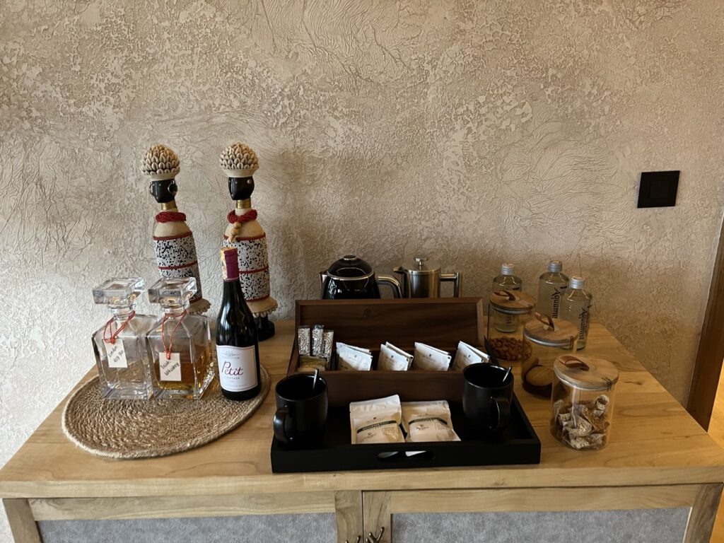 a table with a tray of food and bottles