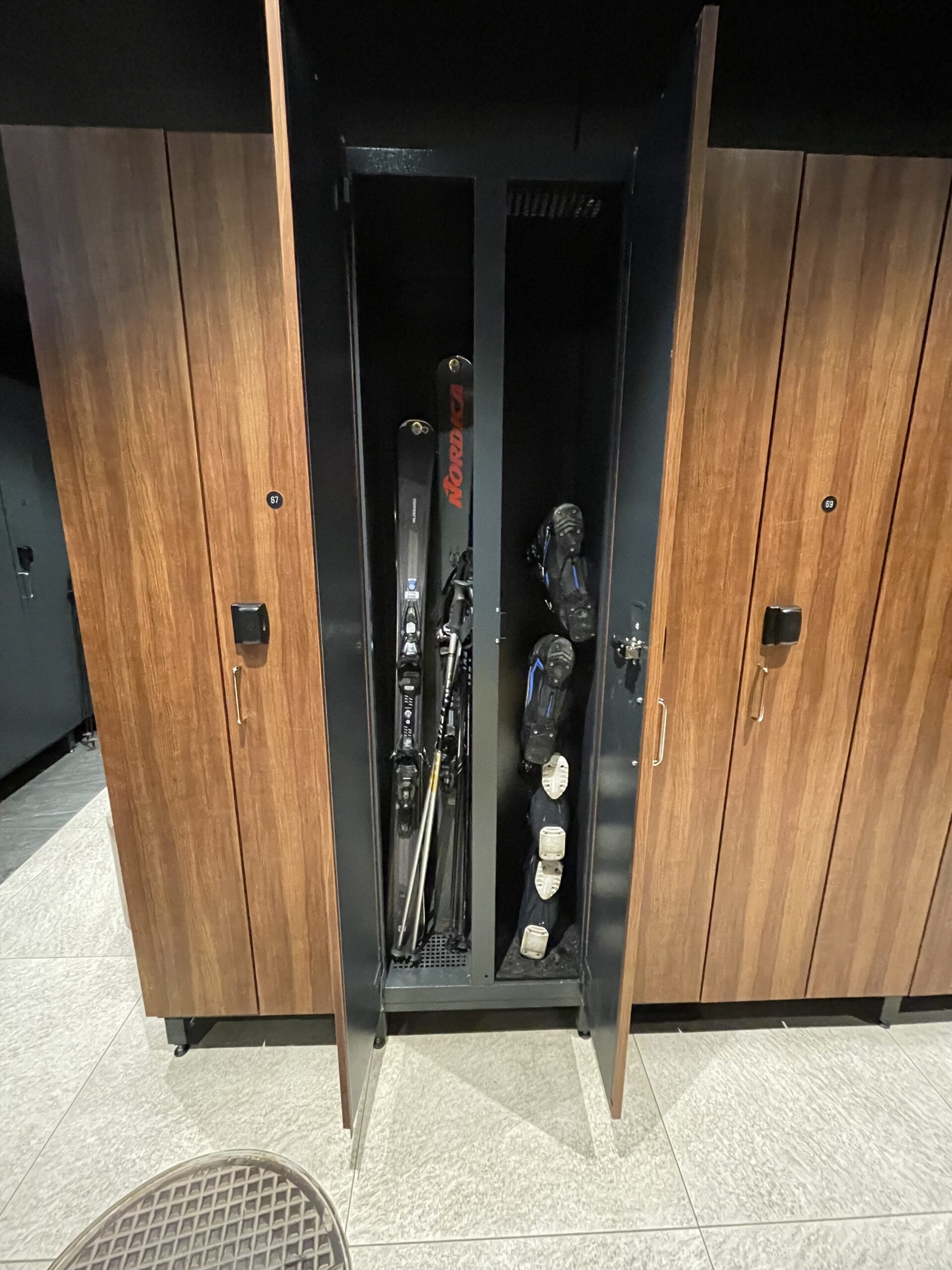 a locker with skis and shoes inside