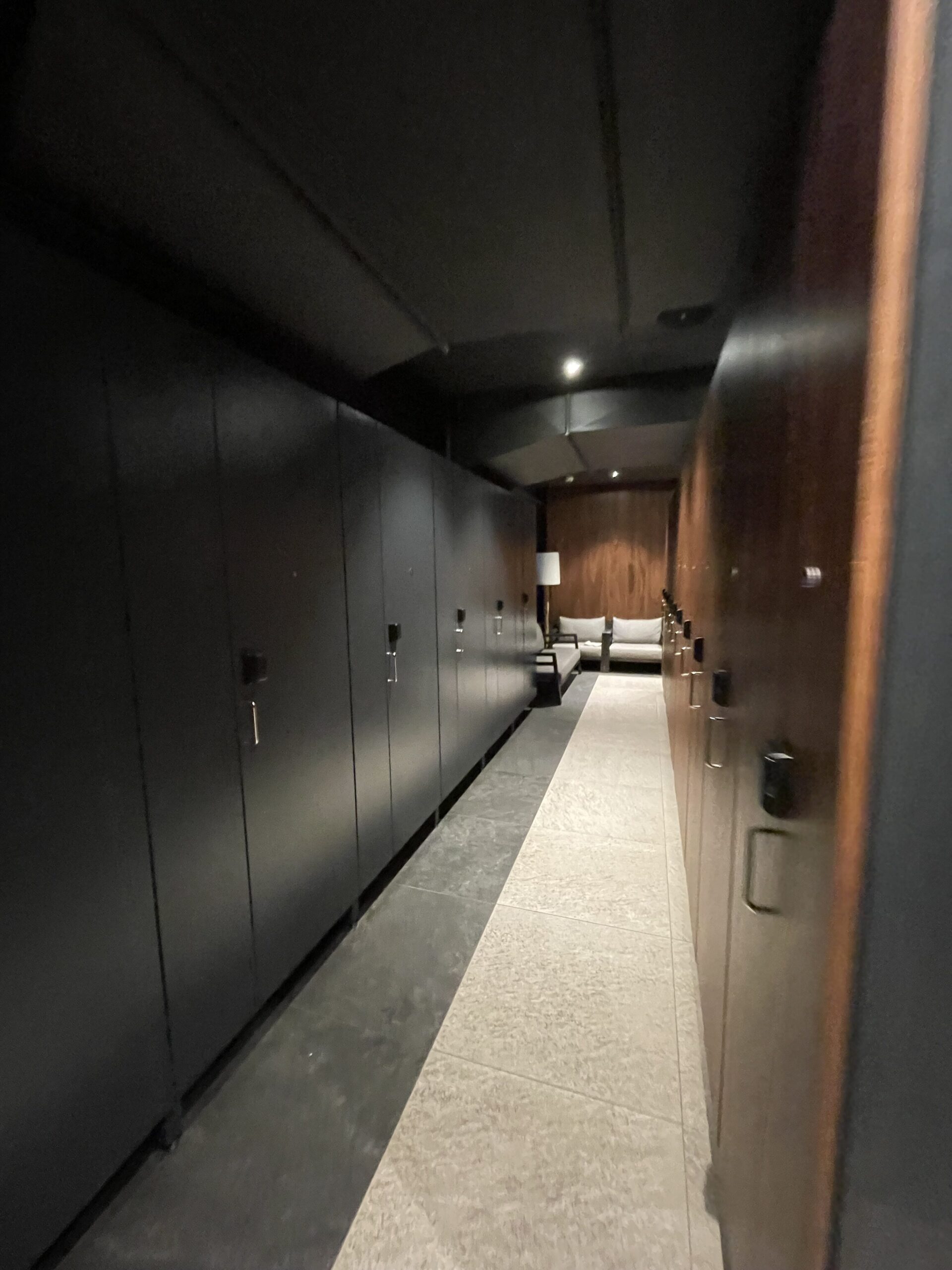 a hallway with black lockers