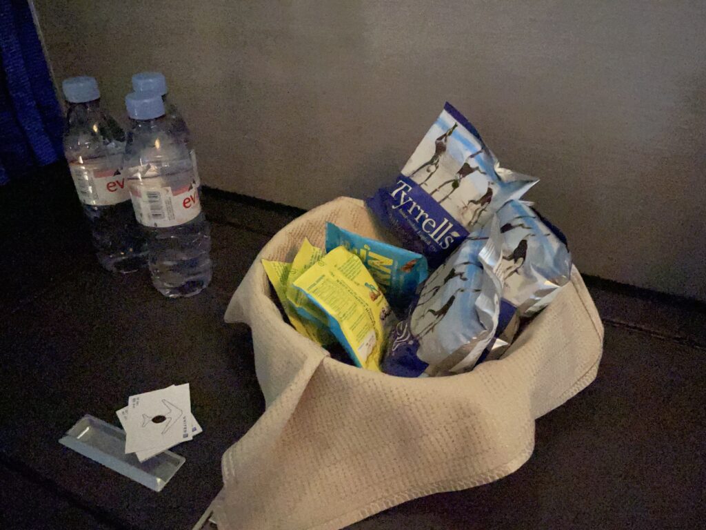 a bag of snacks and water bottles