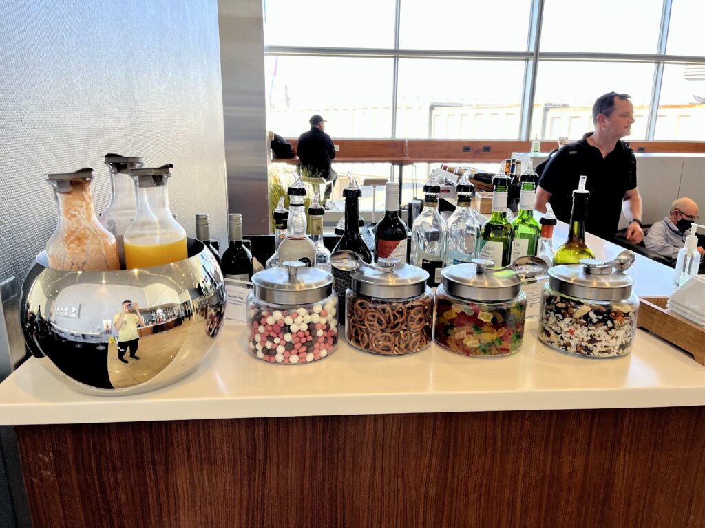 a counter with a variety of candy and other beverages