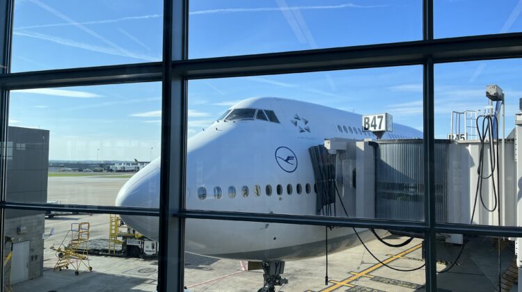 a large white airplane in an airport