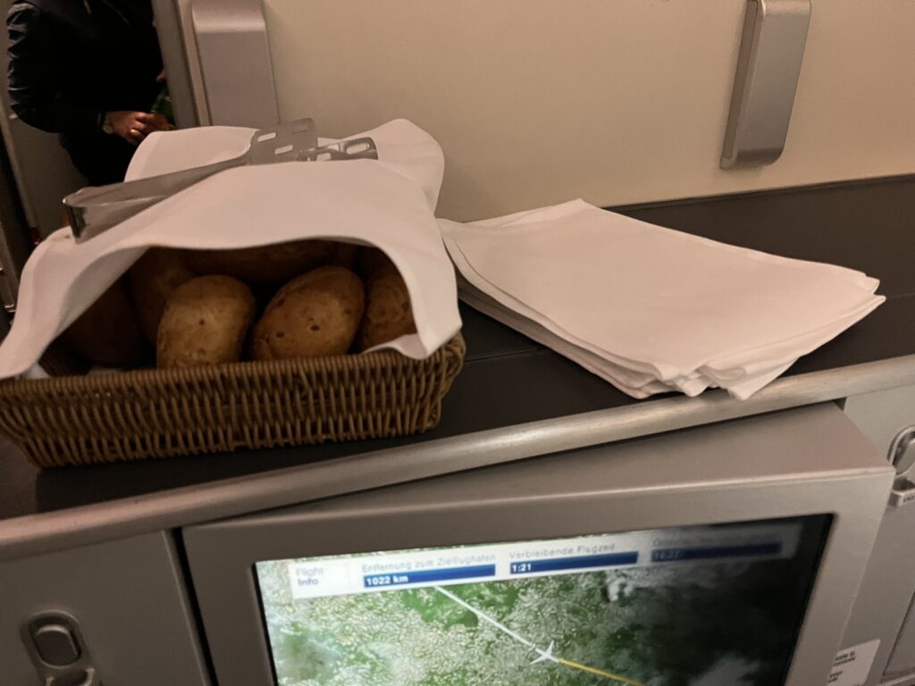 a basket of bread and napkins on a counter