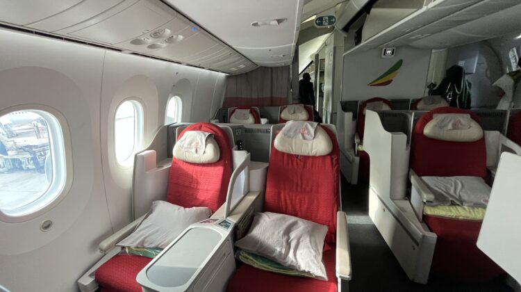 a plane with red seats and windows