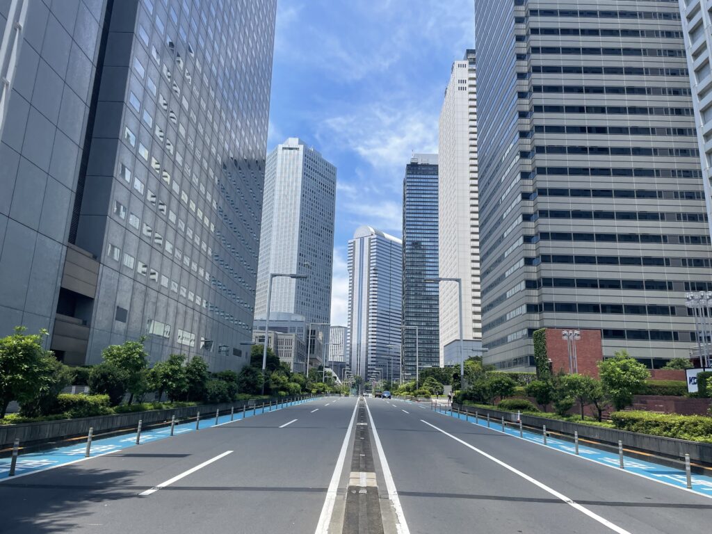a street with tall buildings in the background