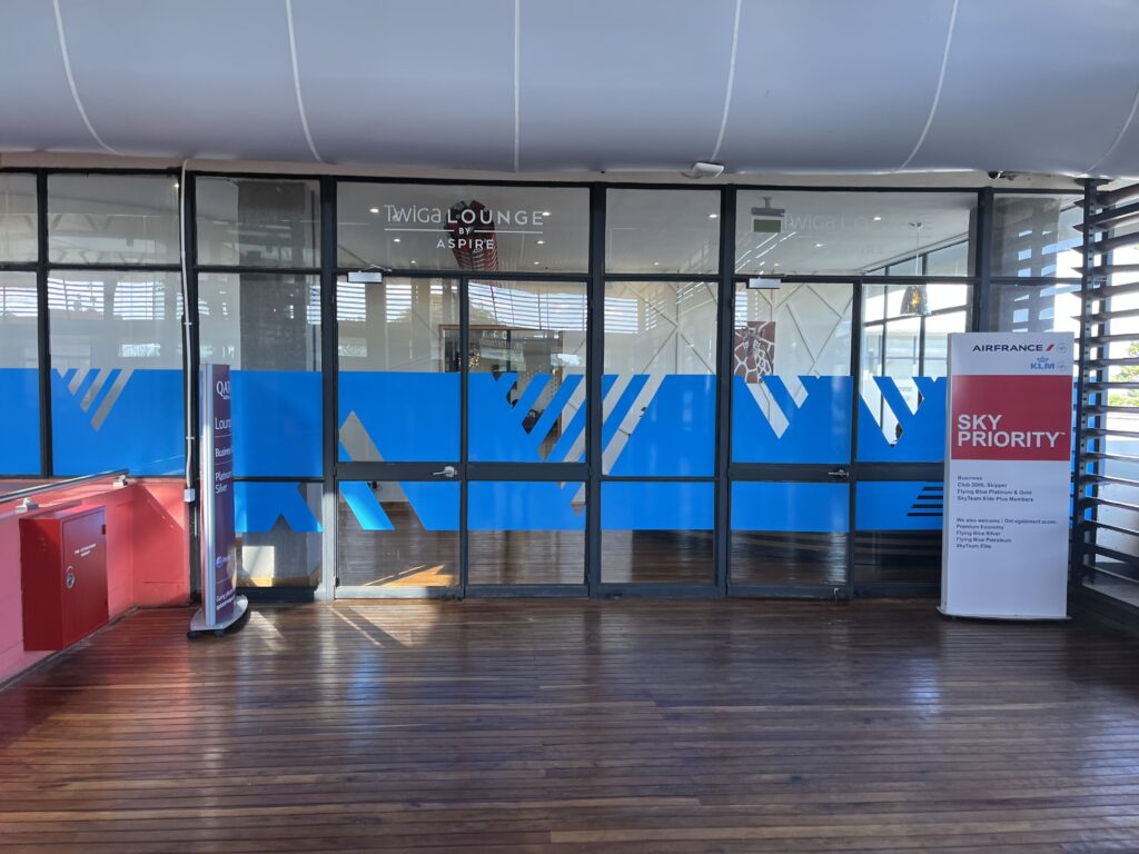 a glass door with a blue and red logo