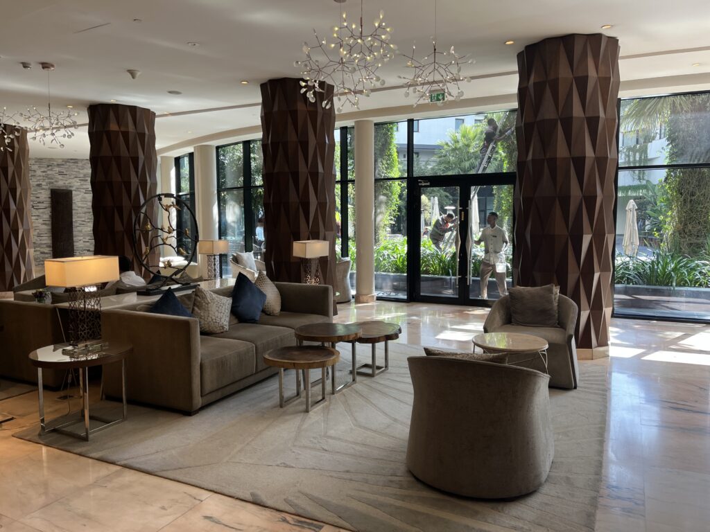 a large lobby with a couch and chairs