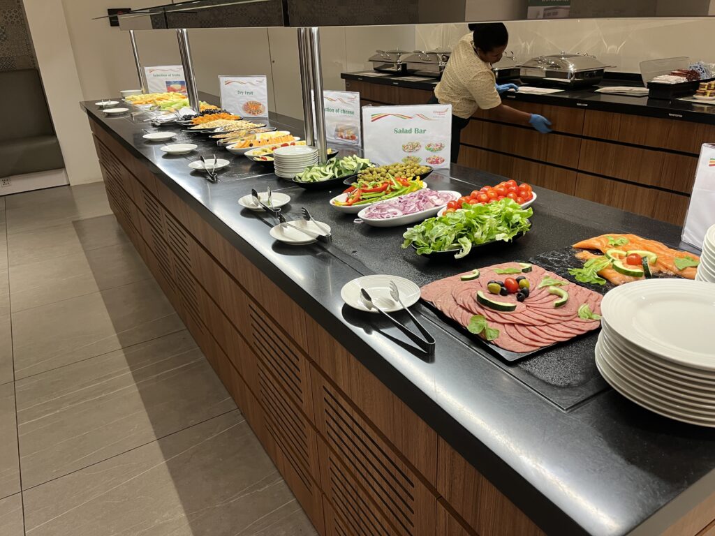 a buffet line with food on plates