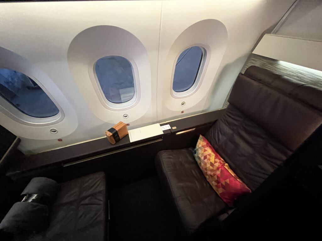 a seat and a pillow on a plane