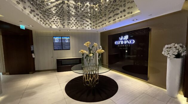 a glass table with flowers in it