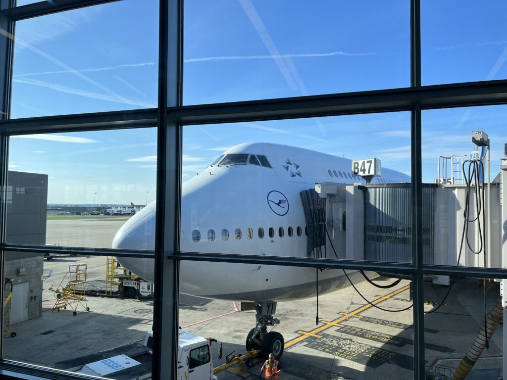 a large white airplane in an airport